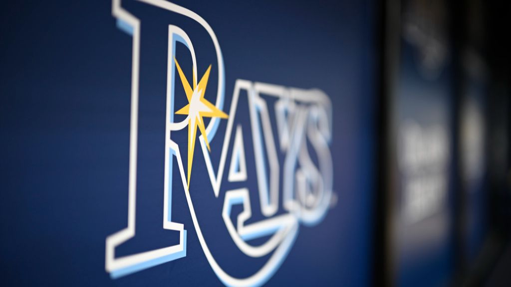 FILE — The Tampa Bay Rays logo is viewed on the dugout wall before a baseball game against the Kansas City Royals, Saturday, May 25, 2024, in St. Petersburg, Fla. (AP Photo/Phelan M. Ebenhack)