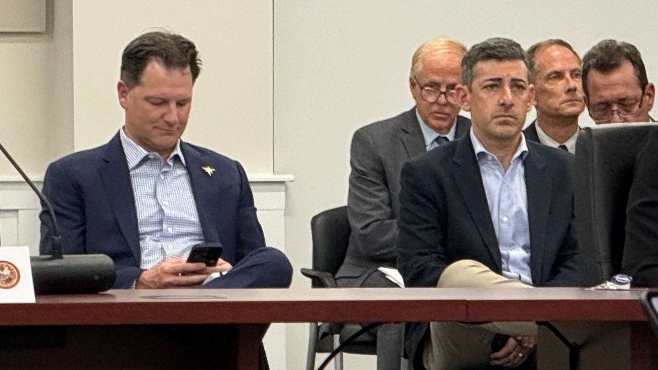 Tampa Bay Rays co-presidents Brian Auld (left) and Matt Silverman (right) sit at a Pinellas County Board of County Commissioners meeting on Nov. 19, 2024. (Spectrum News/Josh Rojas)