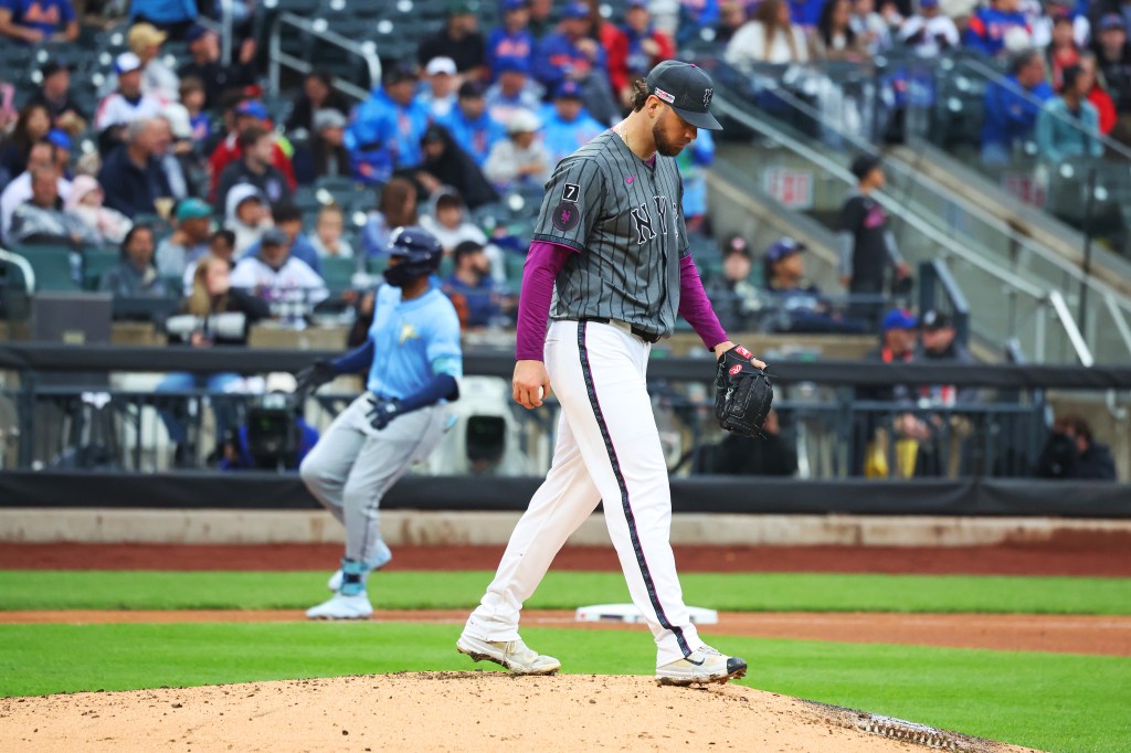 New York Mets pitcher Tylor Megill walking off the mound.