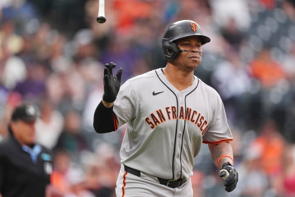 Rafael Devers of the San Francisco Giants flips his bat after hitting a home run.