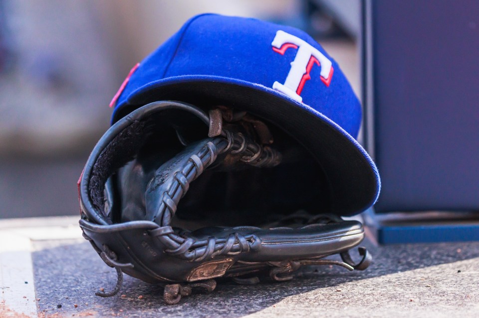 Texas Rangers cap and baseball glove.