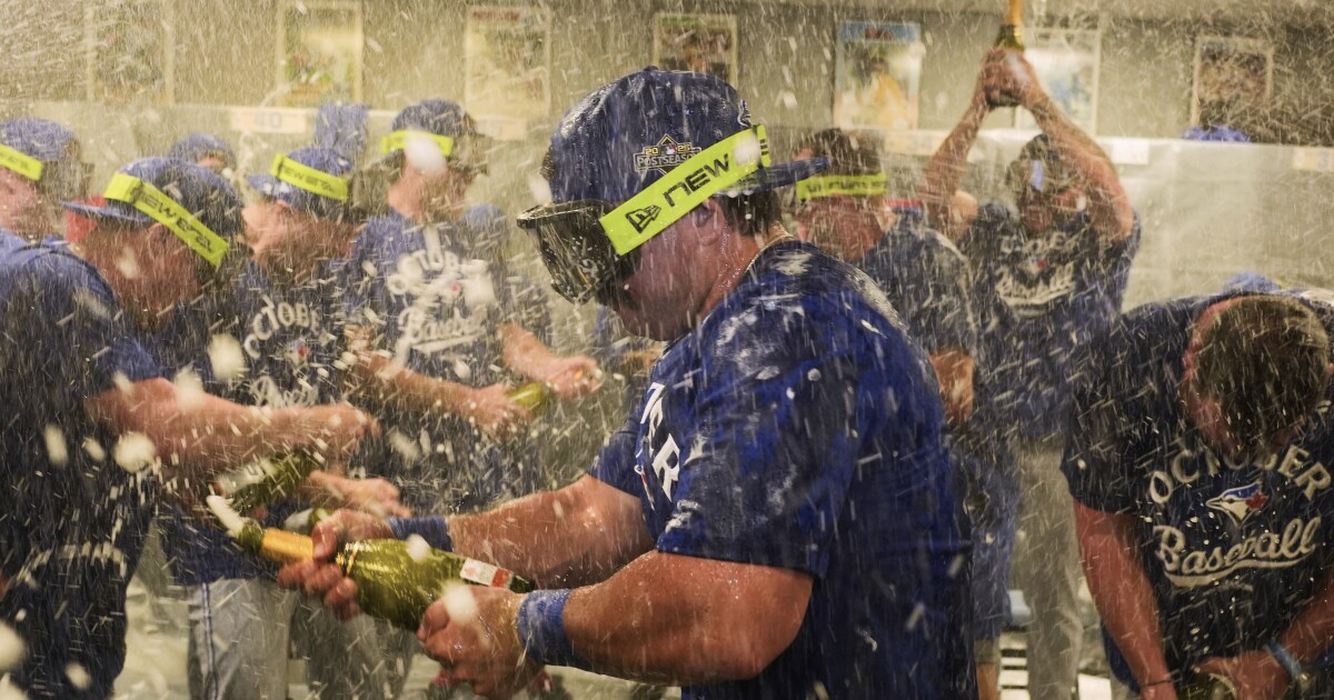 Blue Jays are 1st AL team to clinch playoff spot in 8-5 win over Royals