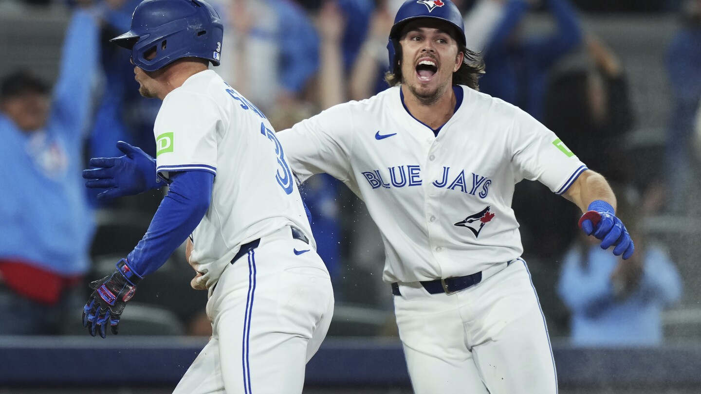 Heineman drives in winning run as Blue Jays rally to beat Astros