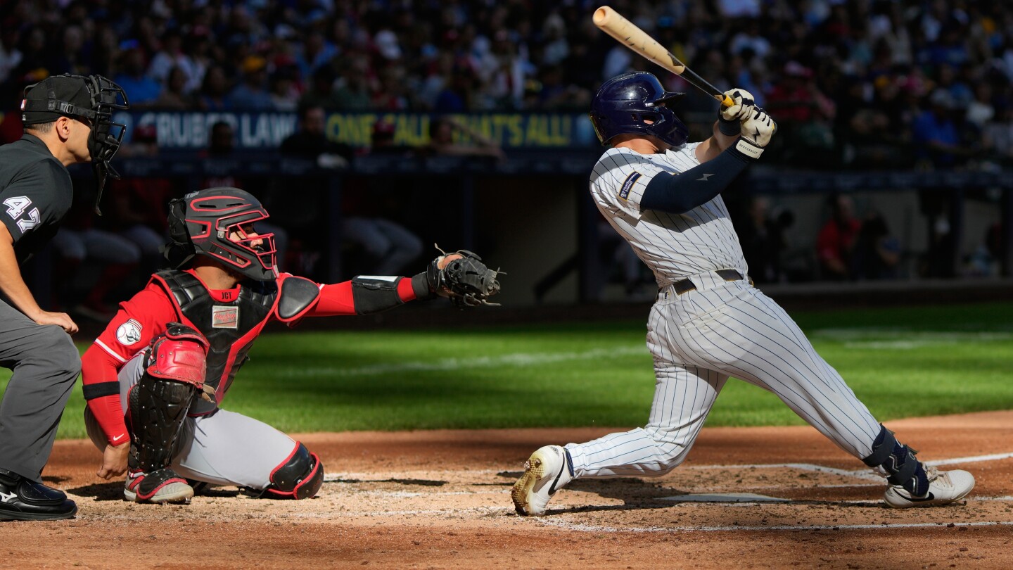 Reds lose 4-2 to Brewers but still earn playoff berth
