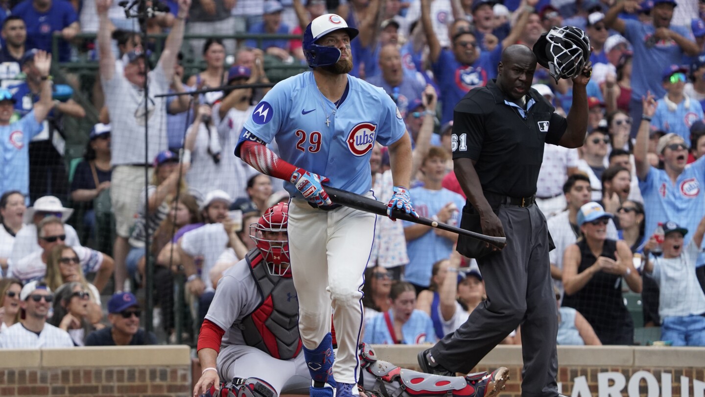 Busch hits 3 homers and Cubs set club record with 8 in 11-3 rout of Cardinals