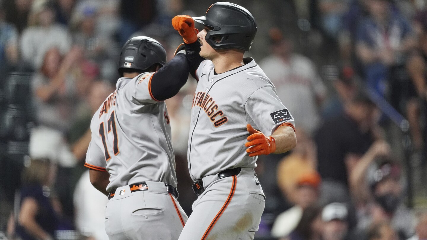 Chapman homers twice after appealing suspension to help the Giants beat the Rockies