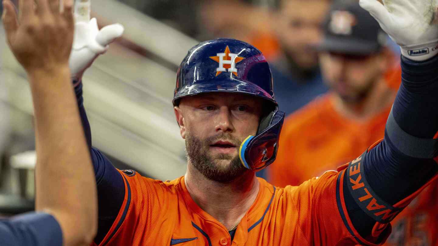 Brown allows only 2 runs and Walker hits homer to power Astros past Braves 6-2