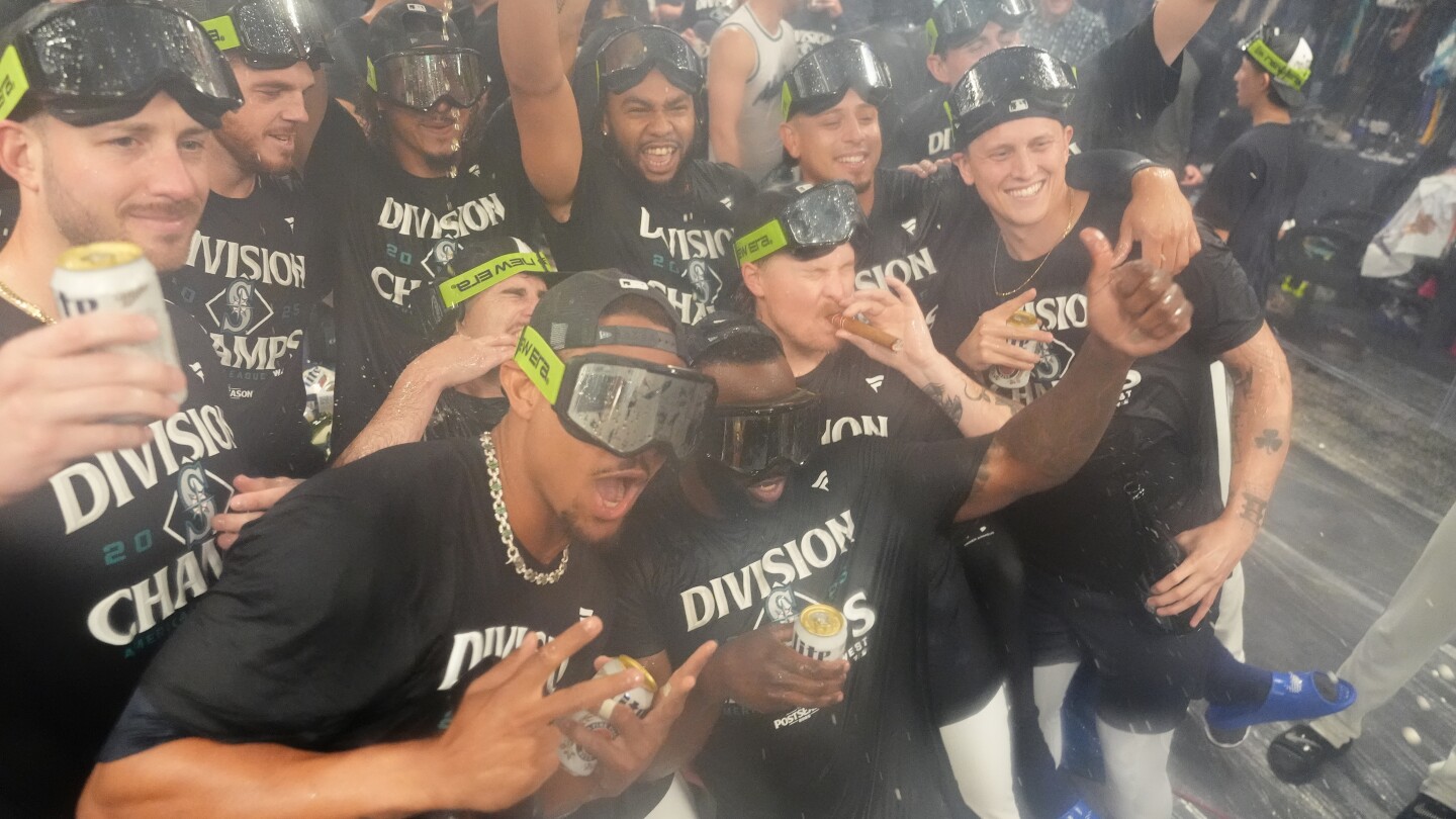 Mariners win AL West for 1st time in 24 years as Raleigh reaches 60 homers in 9-2 win over Rockies