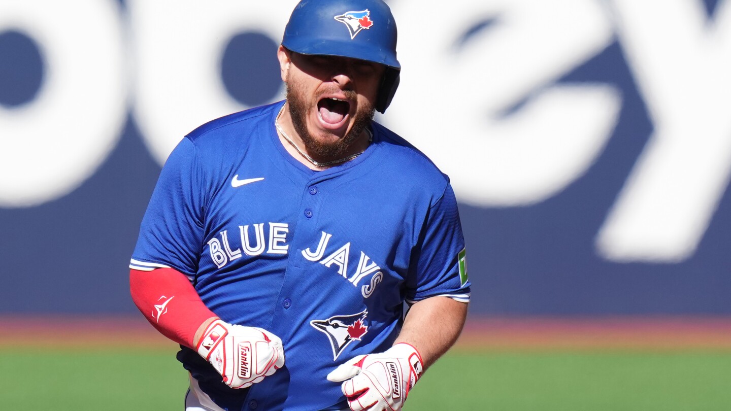 Kirk hits 2 homers, including 1st career slam, as Blue Jays rout Rays 13-4 to clinch AL East title