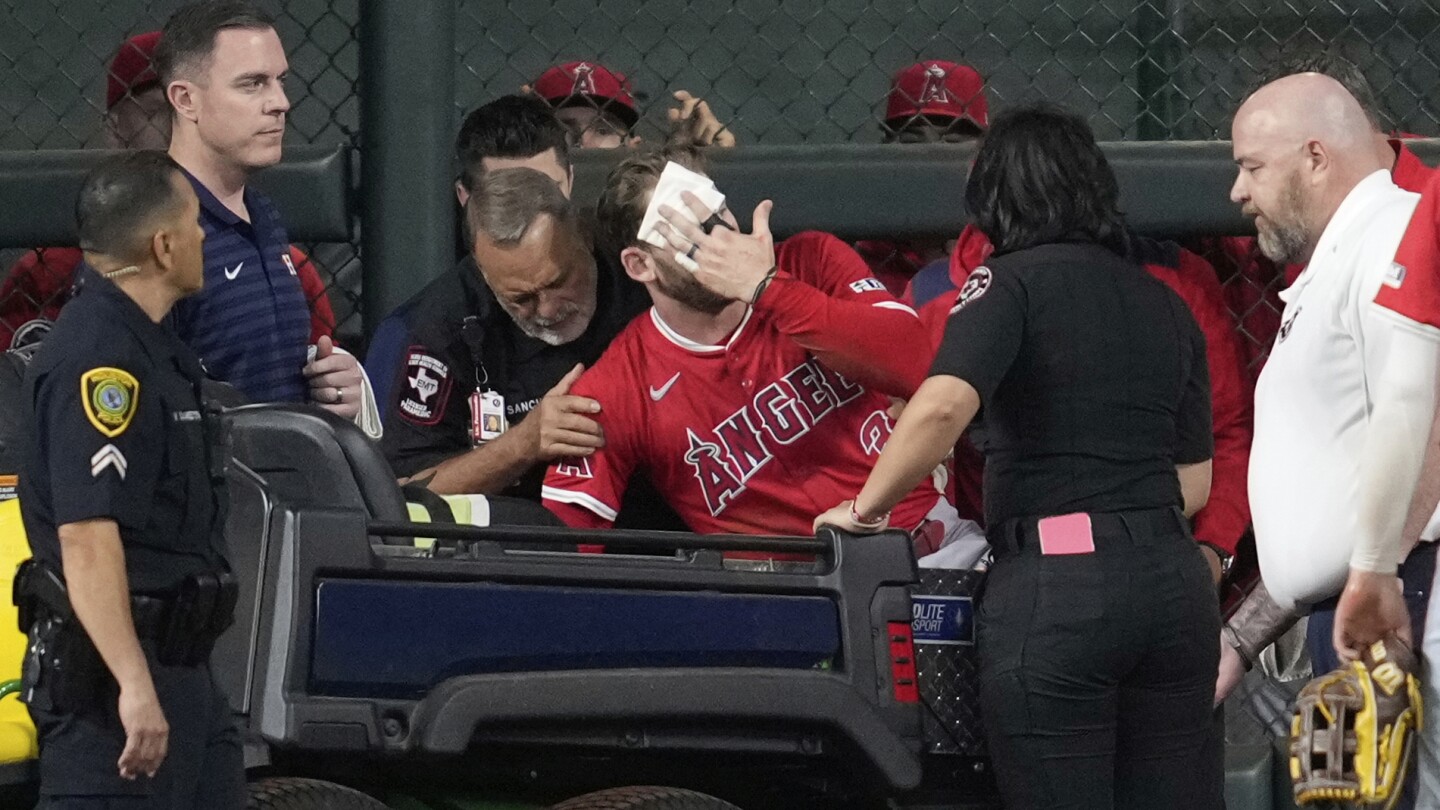 Angels OF Taylor Ward carted off field after crashing into metal scoreboard