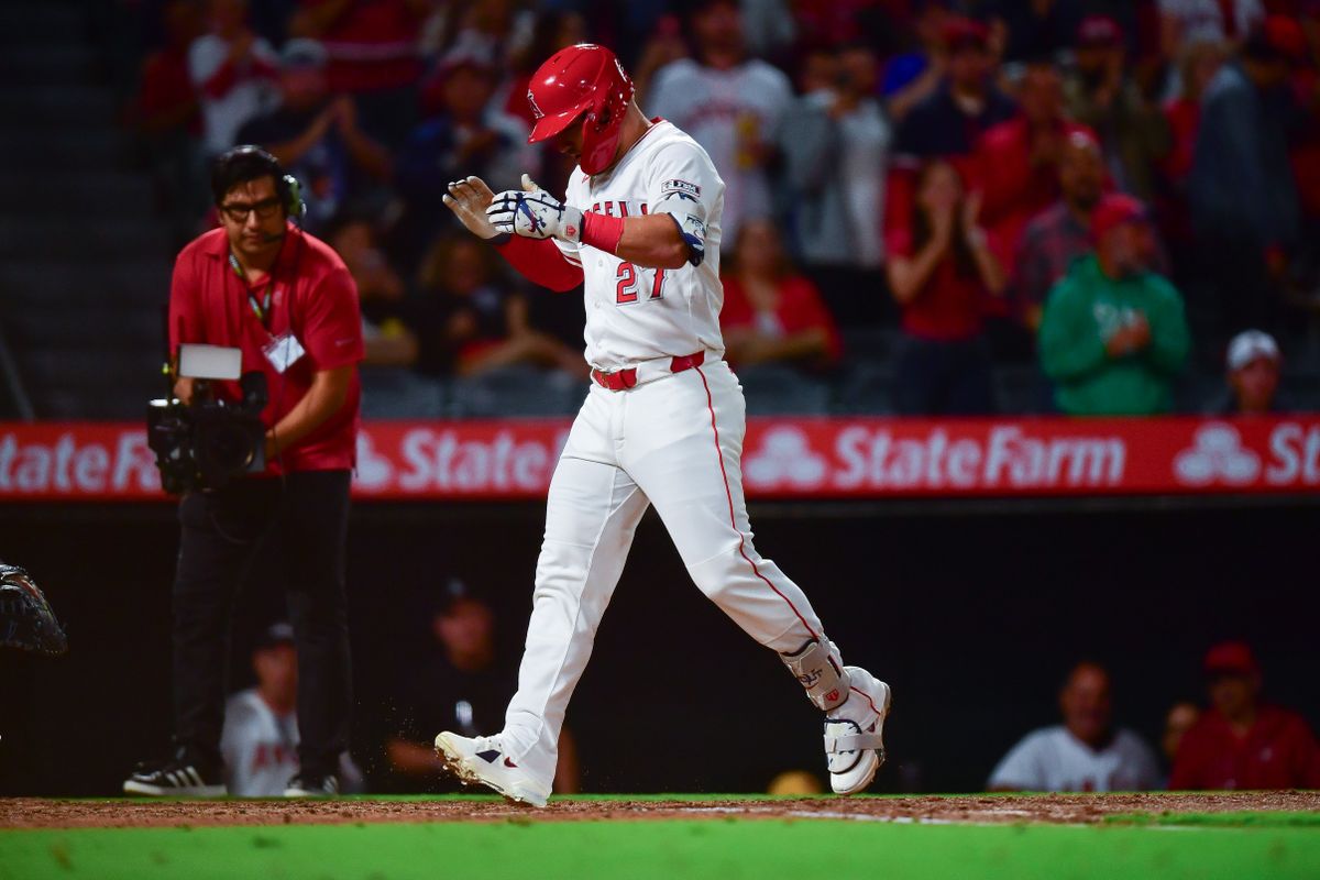 Los Angeles Angels designated hitter Mike Trout (27) celebrates after hitting a solo home run against the Houston Astros during the fourth inning at Angel Stadium. 