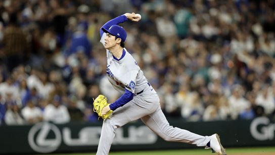 Los Angeles Dodgers pitcher Roki Sasaki (11) throws against the Seattle Mariners at T-Mobile Park. 