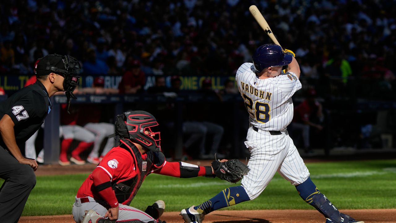 Milwaukee Brewers' Andrew Vaughn hits an RBI double during the fourth inning of a baseball game against the Cincinnati Reds Sunday, Sept. 28, 2025, in Milwaukee.