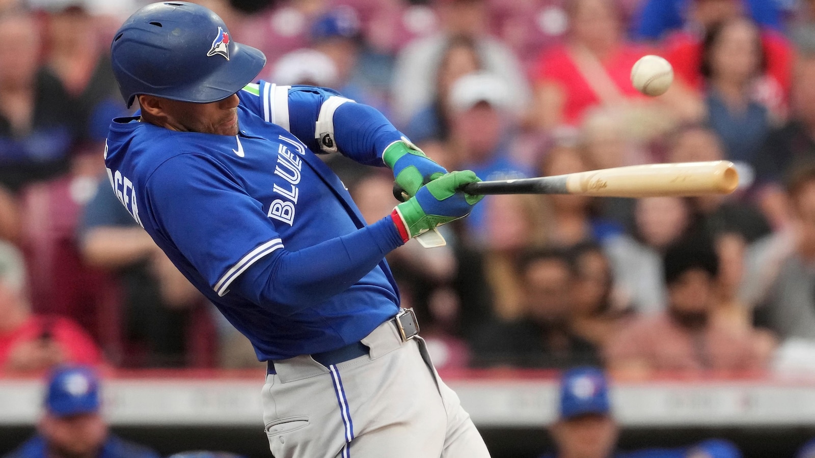 Springer goes deep twice as Blue Jays hold off Reds, 12-9