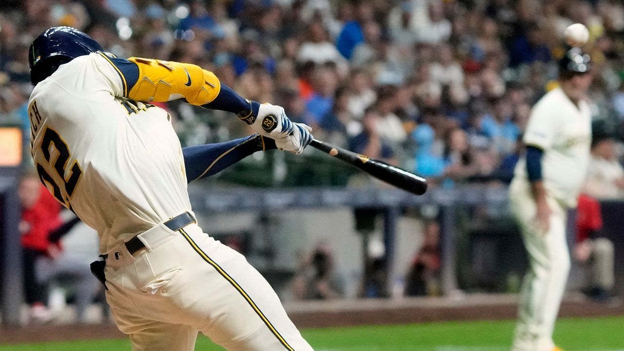 Milwaukee Brewers' Christian Yelich hits an RBI double during the seventh inning of a baseball game against the Los Angeles Angels Thursday, Sept. 18, 2025, in Milwaukee.