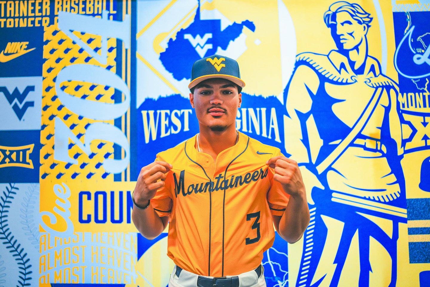 West Virginia Mountaineer fans cheer during the game