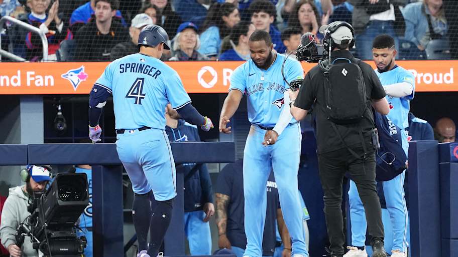 Toronto Blue Jays hitter George Springer celebrates with Vladimir Guerrero Jr. after a home run against the Athletics