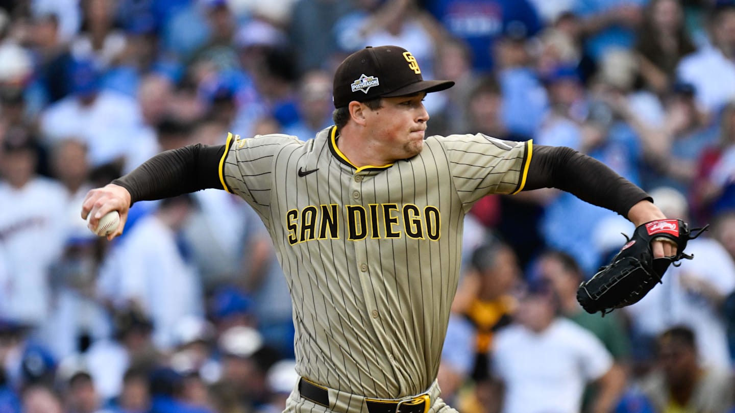 Oct 1, 2025; Chicago, Illinois, USA; San Diego Padres pitcher Mason Miller (22) delivers during the seventh inning against the Chicago Cubs during game two of the Wildcard round for the 2025 MLB playoffs at Wrigley Field. Mandatory Credit: Matt Marton-Imagn Images