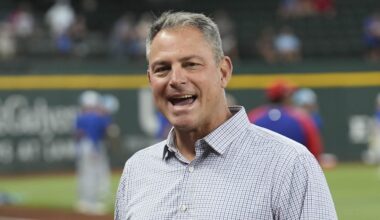 Jun 21, 2024; Arlington, Texas, USA; Texas Rangers general manager Chris Young (left) and Kansas City Royals general manager J.J. Picollo (right) talk before the game against the Kansas City Royals at Globe Life Field. Mandatory Credit: Jim Cowsert-Imagn Images