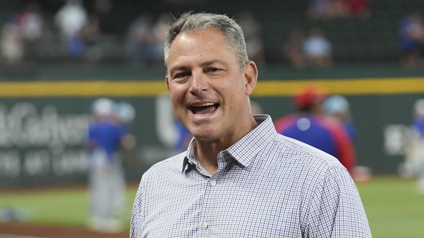 Jun 21, 2024; Arlington, Texas, USA; Texas Rangers general manager Chris Young (left) and Kansas City Royals general manager J.J. Picollo (right) talk before the game against the Kansas City Royals at Globe Life Field. Mandatory Credit: Jim Cowsert-Imagn Images
