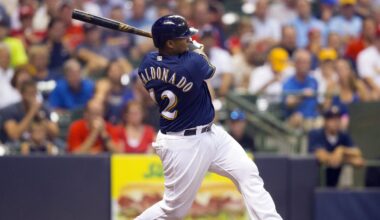 Aug 30, 2016; Milwaukee, WI, USA;  Milwaukee Brewers catcher Martin Maldonado (12) hits an RBI double during the sixth inning against the St. Louis Cardinals at Miller Park. Mandatory Credit: Jeff Hanisch-Imagn Images