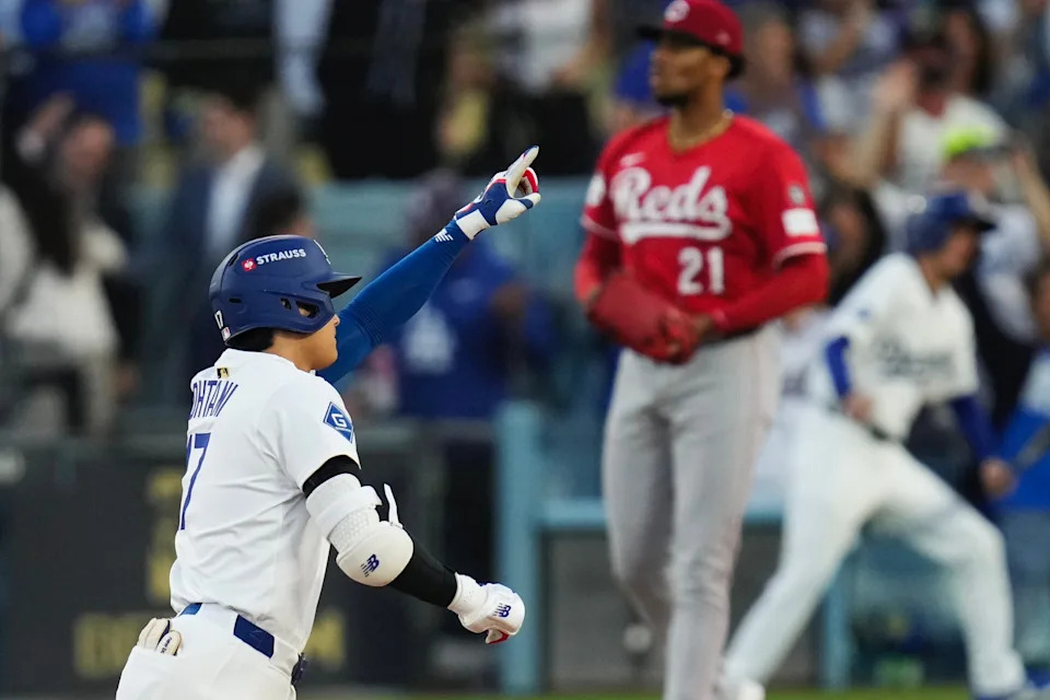 Shohei Ohtani celebrates after hitting a home run in the first inning for the Dodgers in the National League wild card series game in Los Angeles.