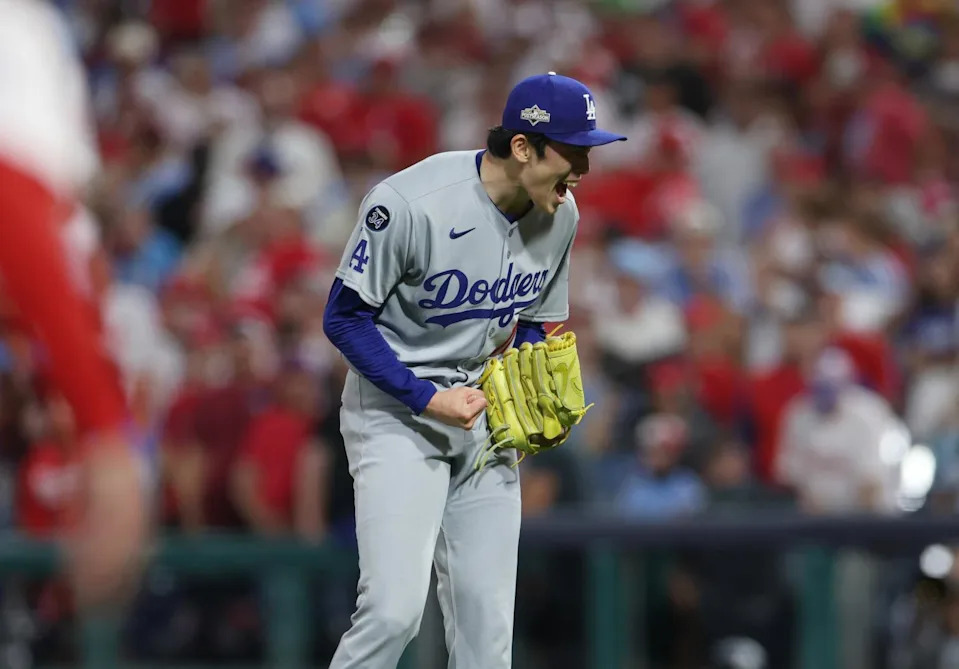 Dodgers pitcher Roki Sasaki celebrates after the final out of a 5-3 win over the Phillies on Saturday.