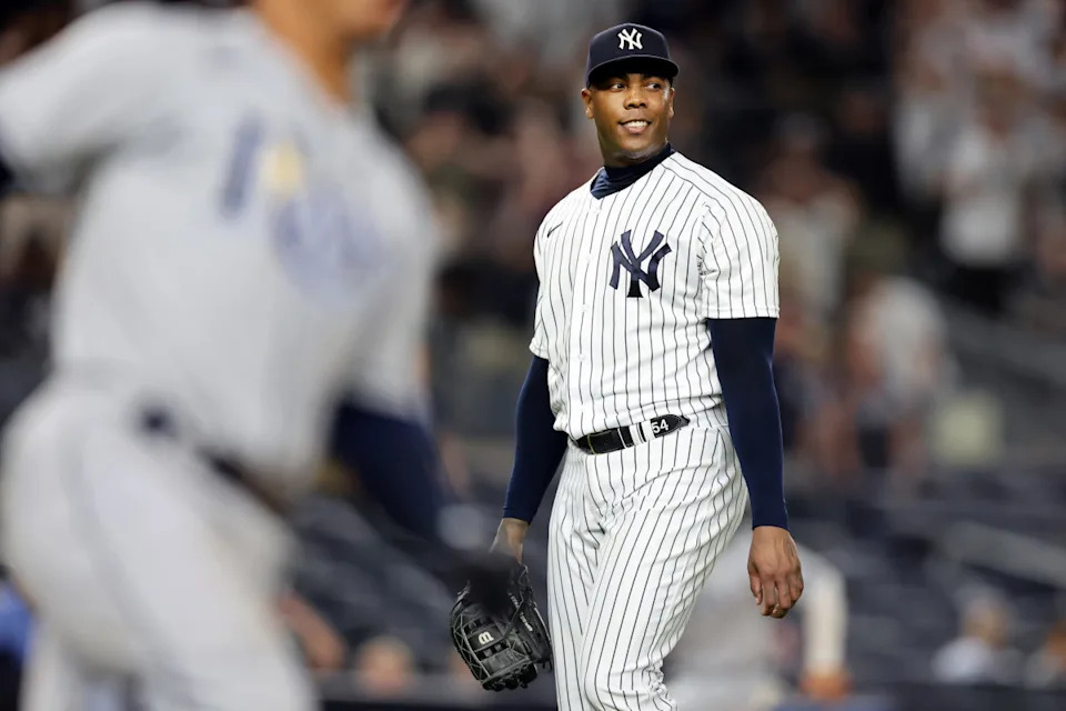 New York Yankees relief pitcher Aroldis Chapman (54) reacts after allowing a three-run double to Tampa Bay Rays catcher Francisco Mejia (not pictured) during the tenth inning at Yankee Stadium. Mandatory Credit: Brad Penner-USA TODAY Sports© Brad Penner-Imagn Images