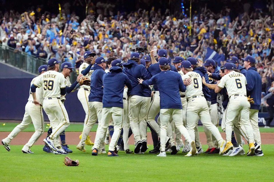 The Brewers celebrate after their Game 5 NLDS series-clinching win over the Cubs. Michael McLoone-Imagn Images
