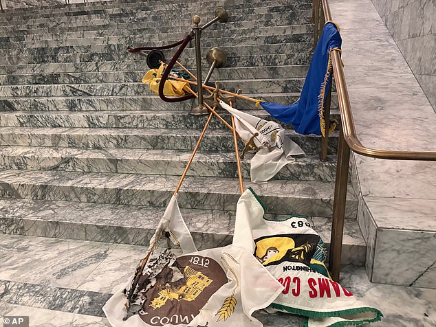 A former MLB draft pick has been accused of breaking into the Washington state Capitol and damaging some of its most iconic items