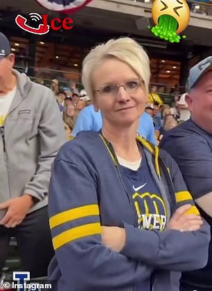 The woman, named online as Shannon Kobylarczyk, looks smugly at the camera after finishing her rant at the veteran