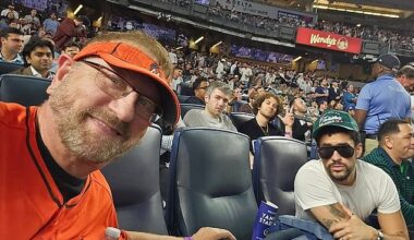 Laurence Leavy pictured with Bad Bunny on the night he sat during 'God Bless America'