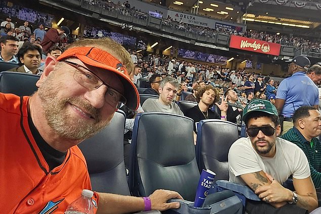 Laurence Leavy pictured with Bad Bunny on the night he sat during 'God Bless America'