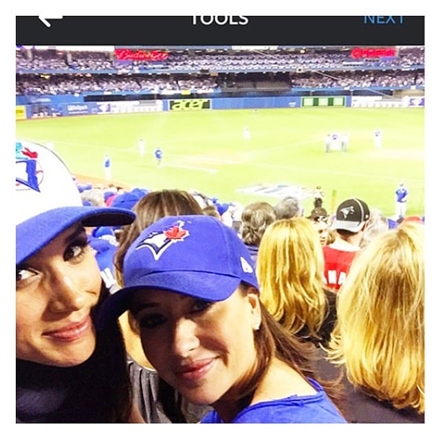 Meghan is seen at a baseball game to cheer on 'our' Blue Jays in 2015