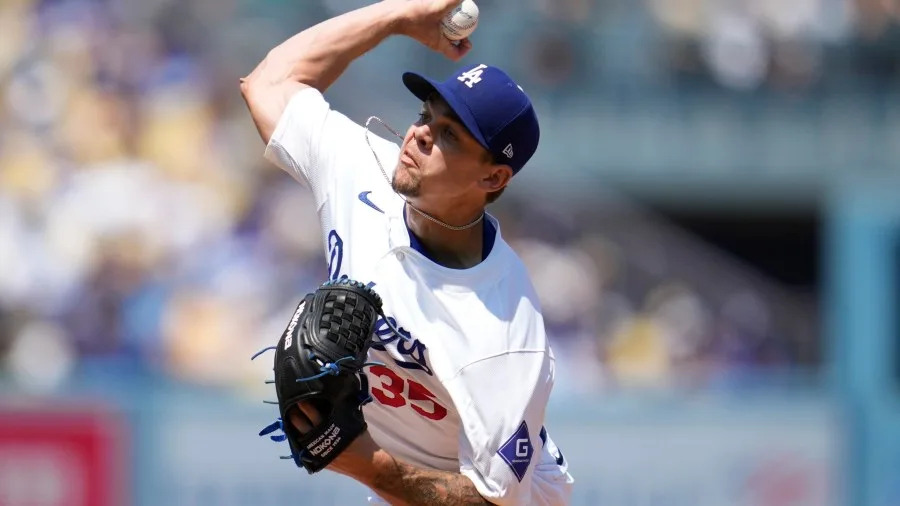 Los Angeles Dodgers starting pitcher Gavin Stone (35) throws during a baseball game against the Tampa Bay Rays in Los Angeles, Sunday, August 25, 2024. (AP Photo/Ashley Landis)