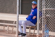 Texas Rangers manager Bruce Bochy watches pitchers fielding practice during a spring...