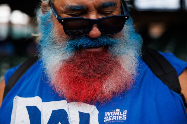 Paul "Santa" Margolis walks in the stands before the Cubs...