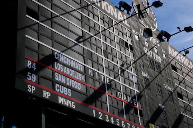 The centerfield scoreboard before the Cubs host the Padres in...