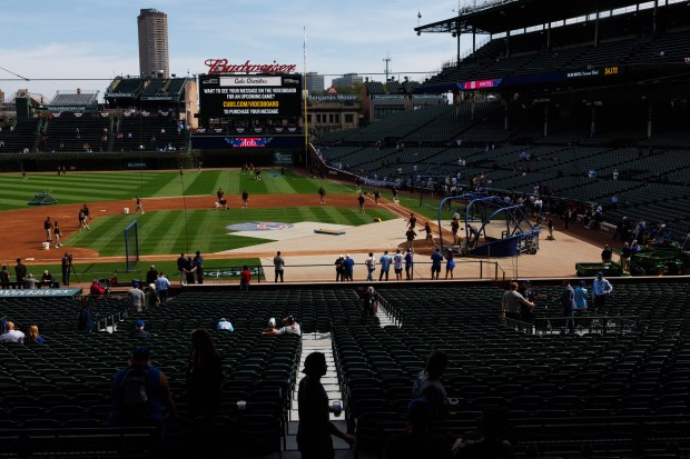 Padres players warm up before facing the Cubs in Game...