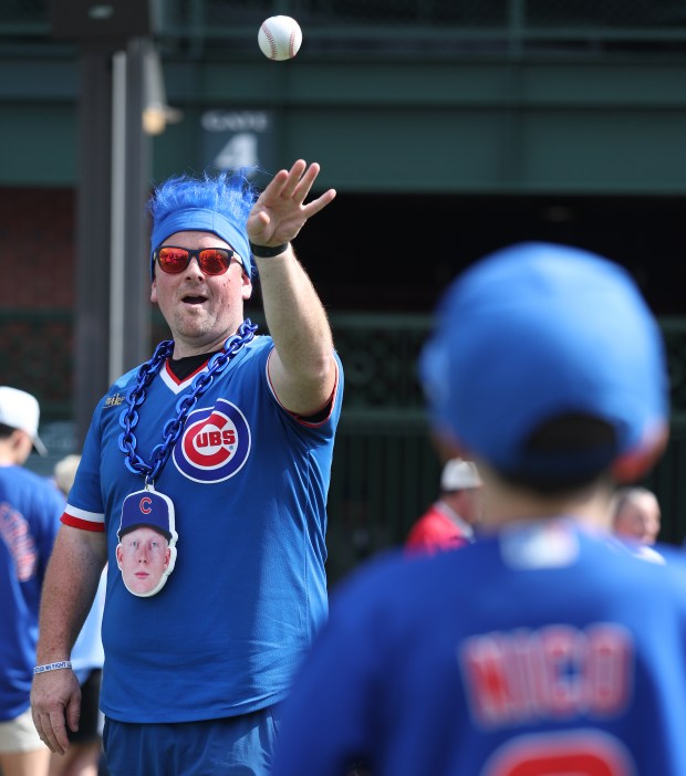 Pete Crow-Armstrong fan Ryan Denk, of Caledonia, plays catch outside...