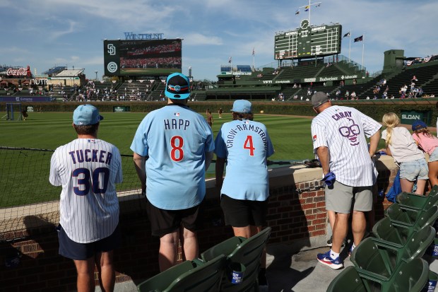 Cubs fans take in batting practice before Game 3 of...