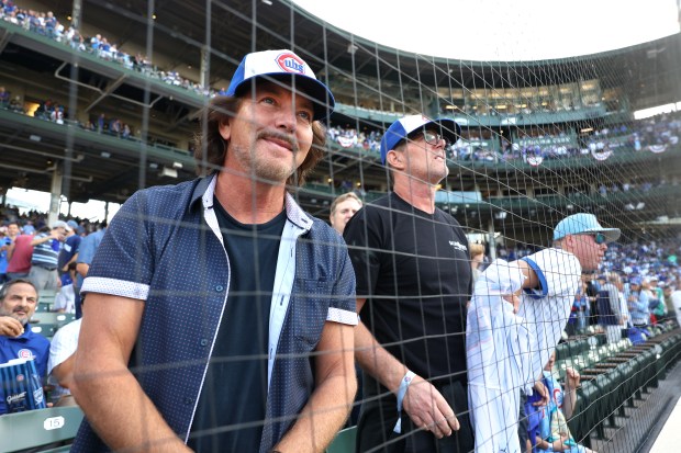 Cubs fan Eddie Vedder takes in the scene before Game...