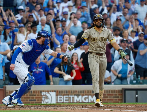 Fernando Tatis Jr. #23 of the San Diego Padres strikes out in the third inning as Carson Kelly #15 of the Chicago Cubs leaves the field during Game 3 of the NL Wild Card Series at Wrigley Field on Oct. 2, 2025 in Chicago, Illinois. (Photo by K.C. Alfred / The San Diego Union-Tribune)