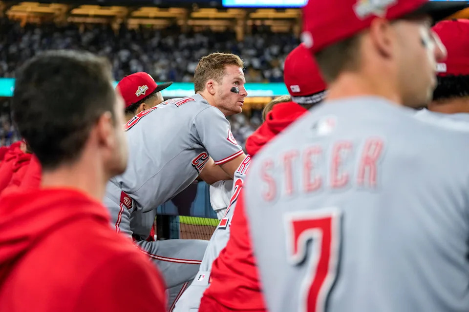 The Reds young players, like Matt McLain (center), are sure to benefit from the experience of a pennant race and postseason competition, even if it was a two-game sweep at the hands of the Dodgers.