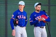Texas Rangers pitcher Jacob deGrom (left) talks with pitcher Nathan Eovaldi before throwing...
