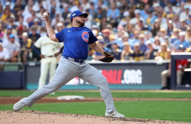Chicago Cubs relief pitcher Aaron Civale (38) delivers to the...