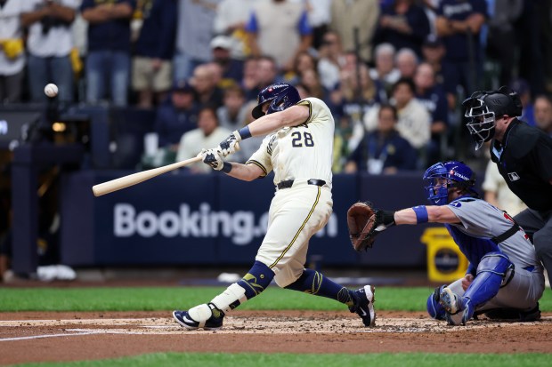 The Brewers' Andrew Vaughn hits a three-run homer during the...