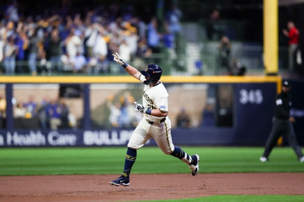Brewers' Andrew Vaughn runs the bases after hitting a three-run...