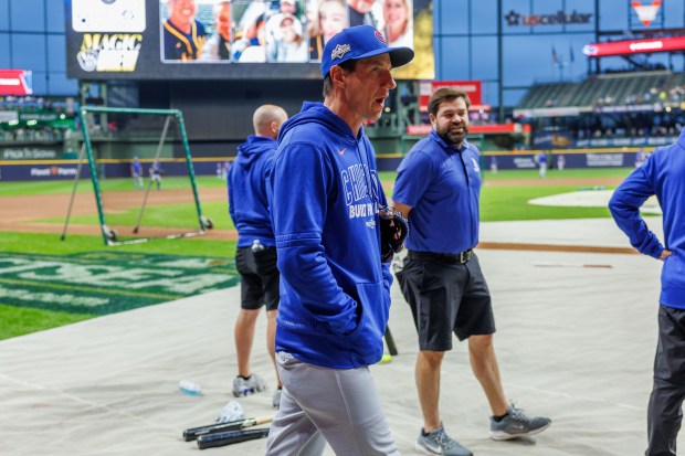 Chicago Cubs manager Craig Counsell (11) walks on the field...