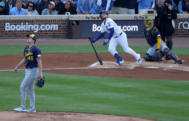 Chicago Cubs first baseman Michael Busch watches his solo home...